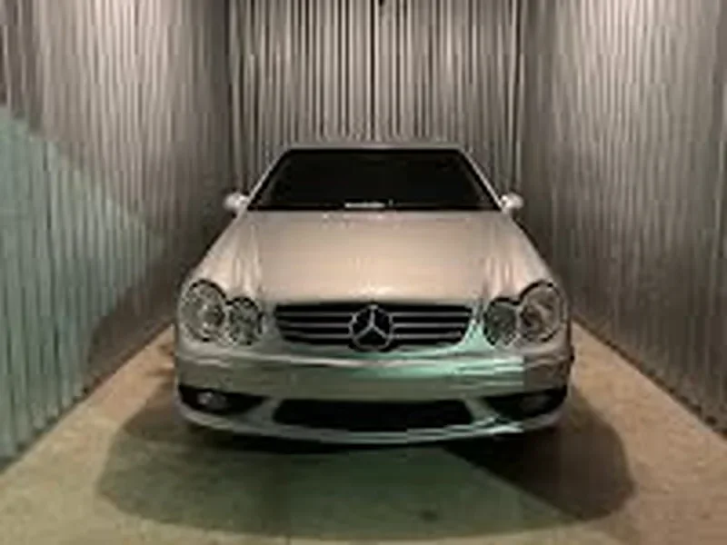 A car parked inside an enclosed vehicle storage unit at AAA Stock 'n Lock