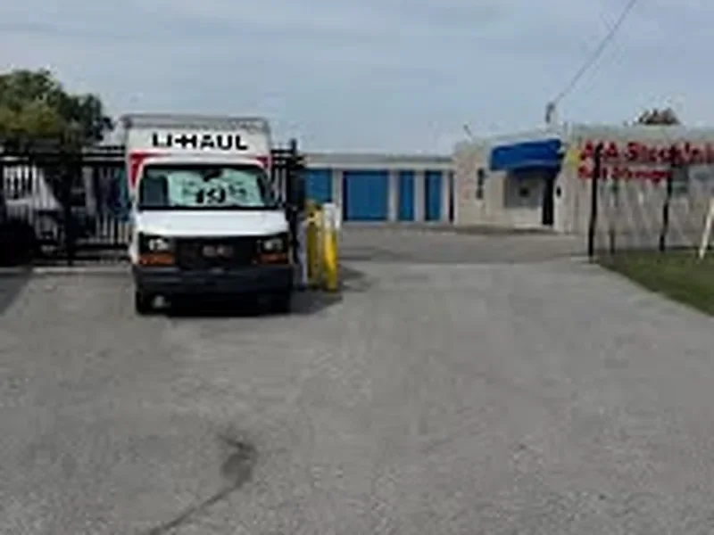 A U-Haul truck parked at the entrance of AAA Stock 'n Lock in Windsor, Ontario